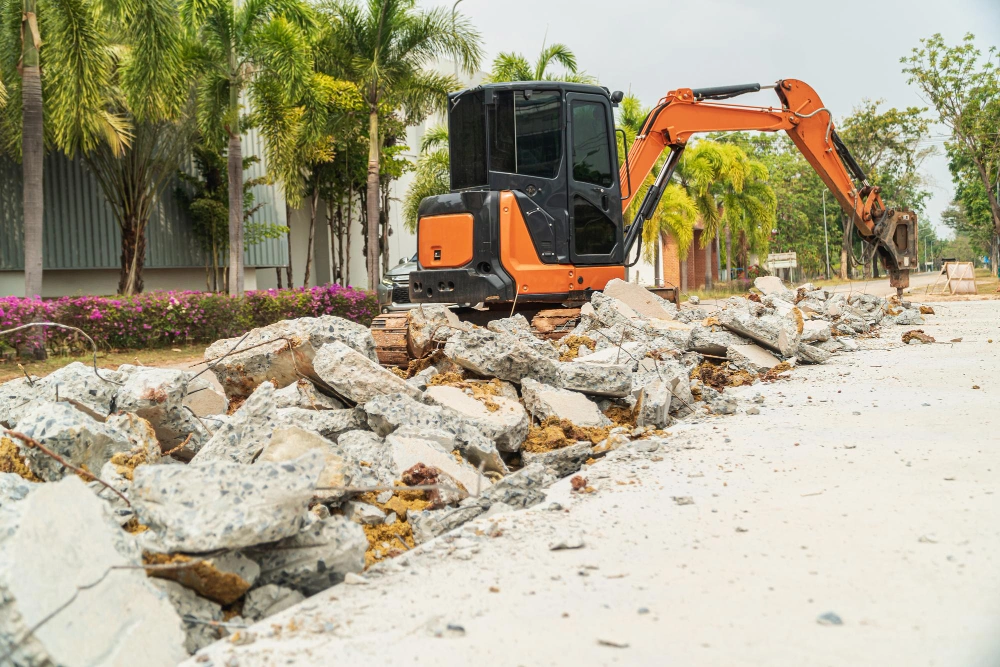 Asphalt and concrete removal project with excavator breaker for site preparation in Los Angeles